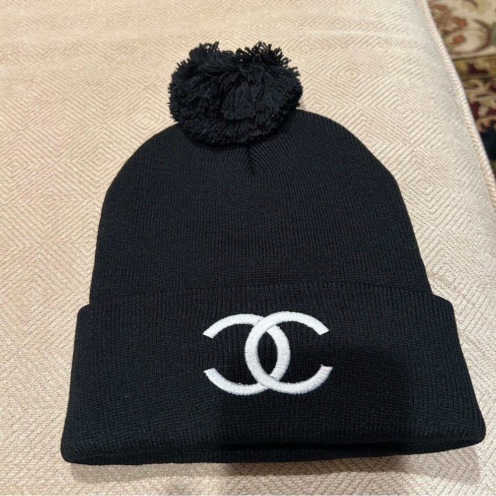 Black with white embroidered women’s Pom Pom hat